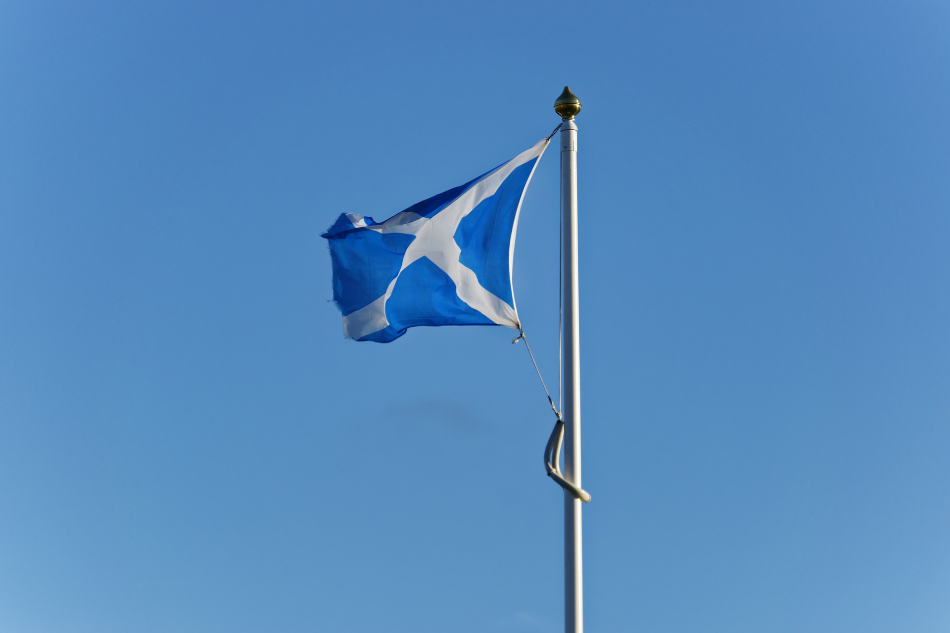 Scottish flag flying from a flag pole