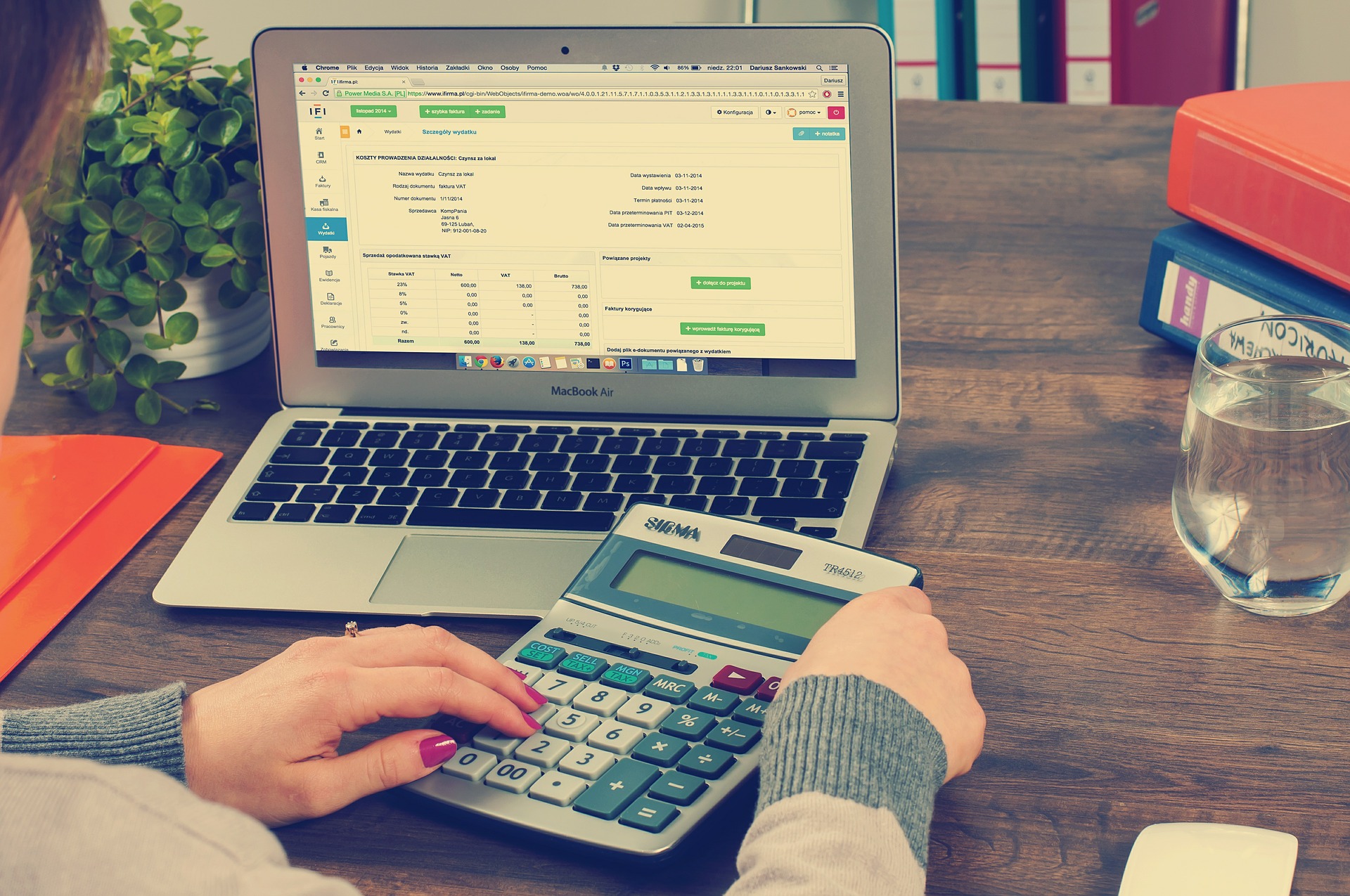 female bookkeeper calculating business finances