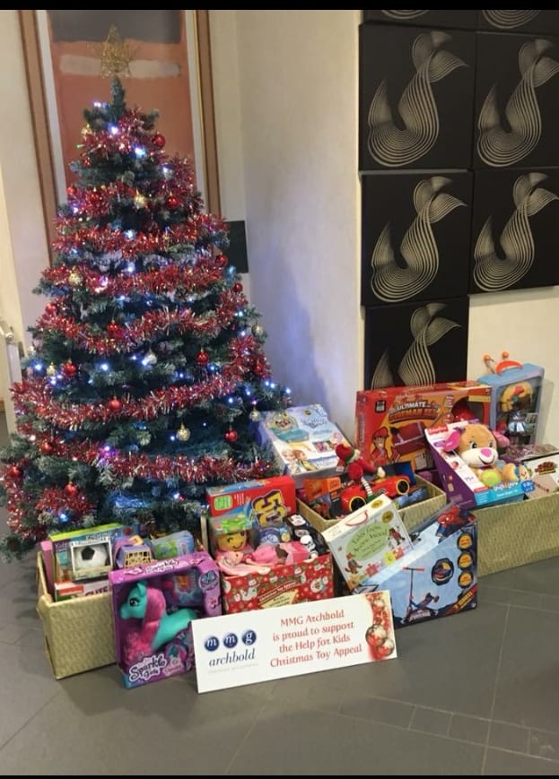 Christmas tree and presents in support of Cash for Kids